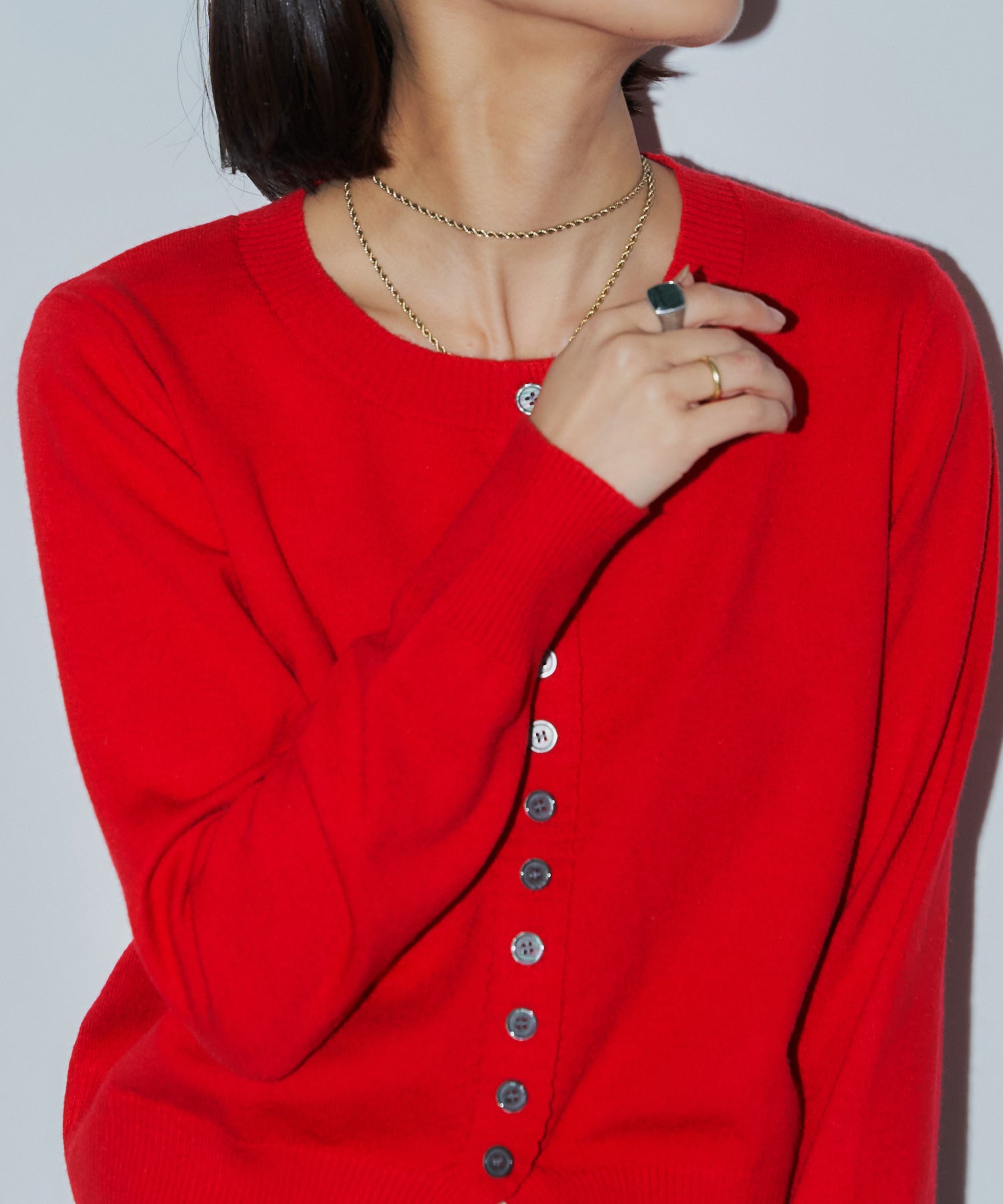 メニーボタンスリットカーデ