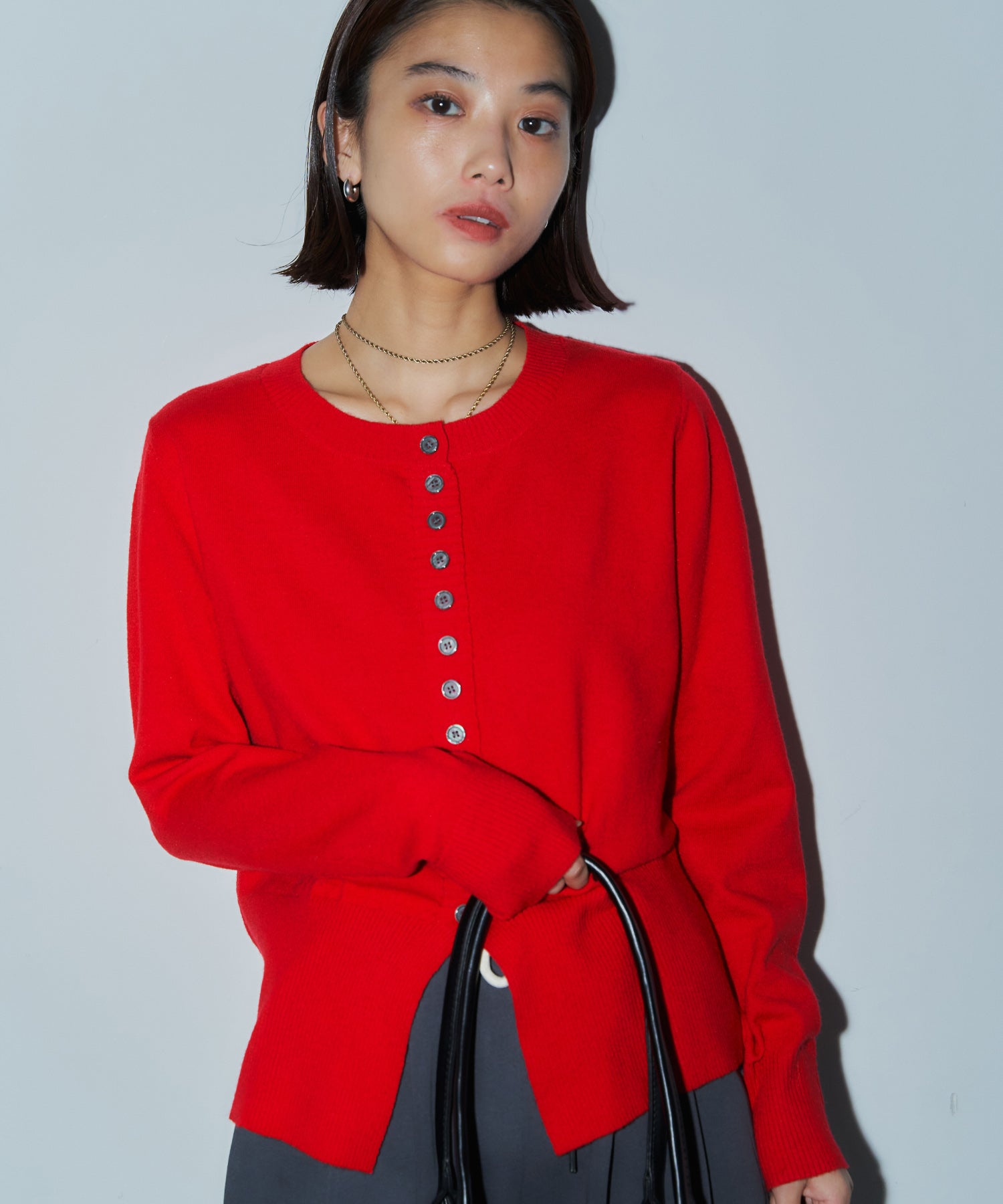 メニーボタンスリットカーデ